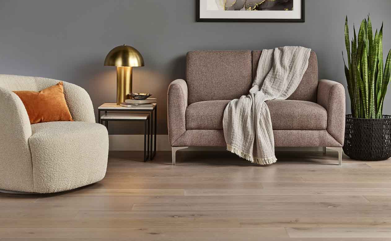  hardwood flooring in a living room with accent chair
